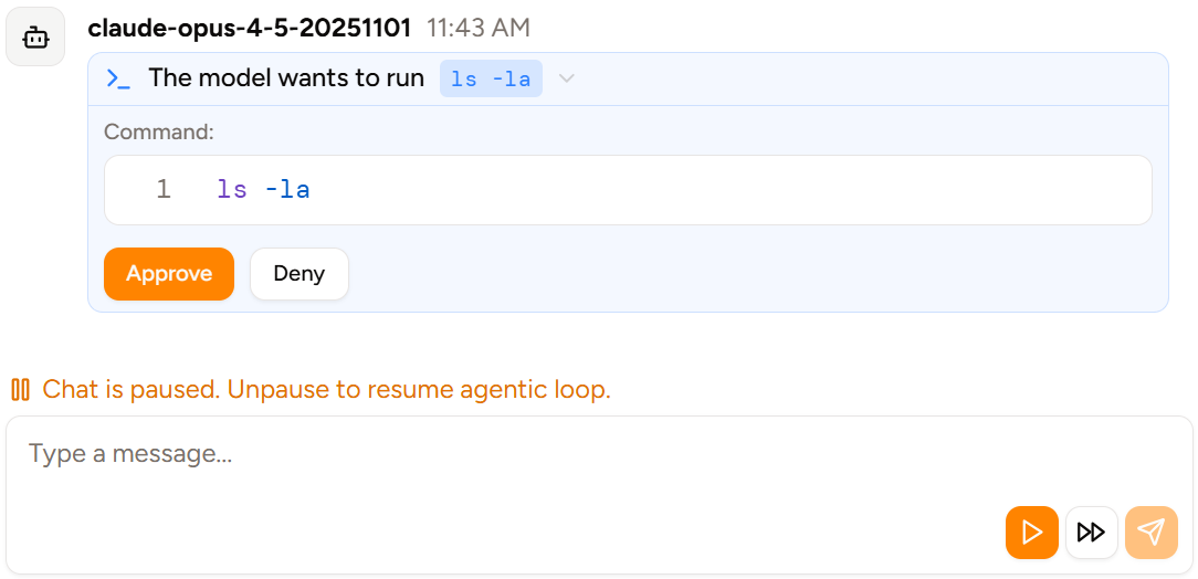 Screenshot of `ls -la` not being auto-approved because the chat has been paused.