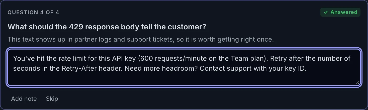 A free-text question card asking what the 429 response body should tell the customer, with a typed answer.