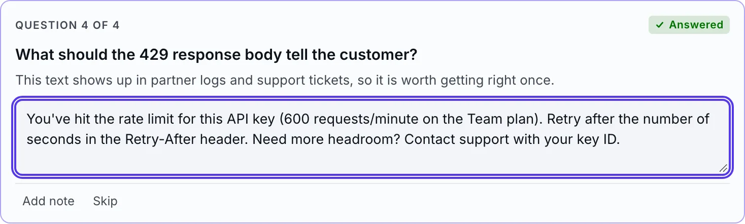 A free-text question card asking what the 429 response body should tell the customer, with a typed answer.