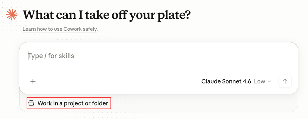 The Claude Cowork start screen with the Work in a project or folder option below the message box