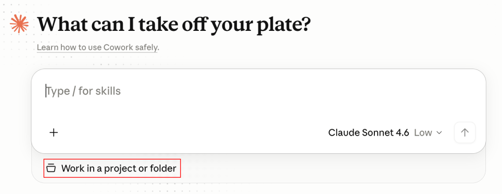 The Claude Cowork start screen with the Work in a project or folder option below the message box