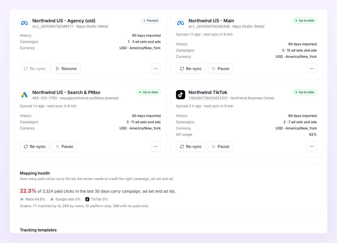 Connected ad account cards showing Paused and Up to date states