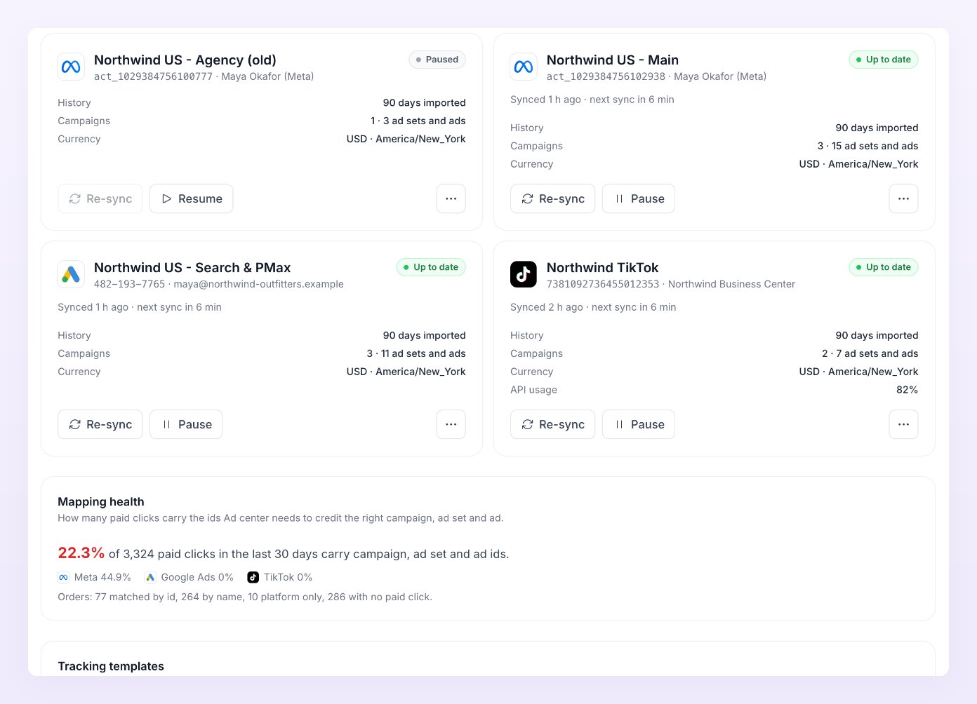 Connected ad account cards showing Paused and Up to date states