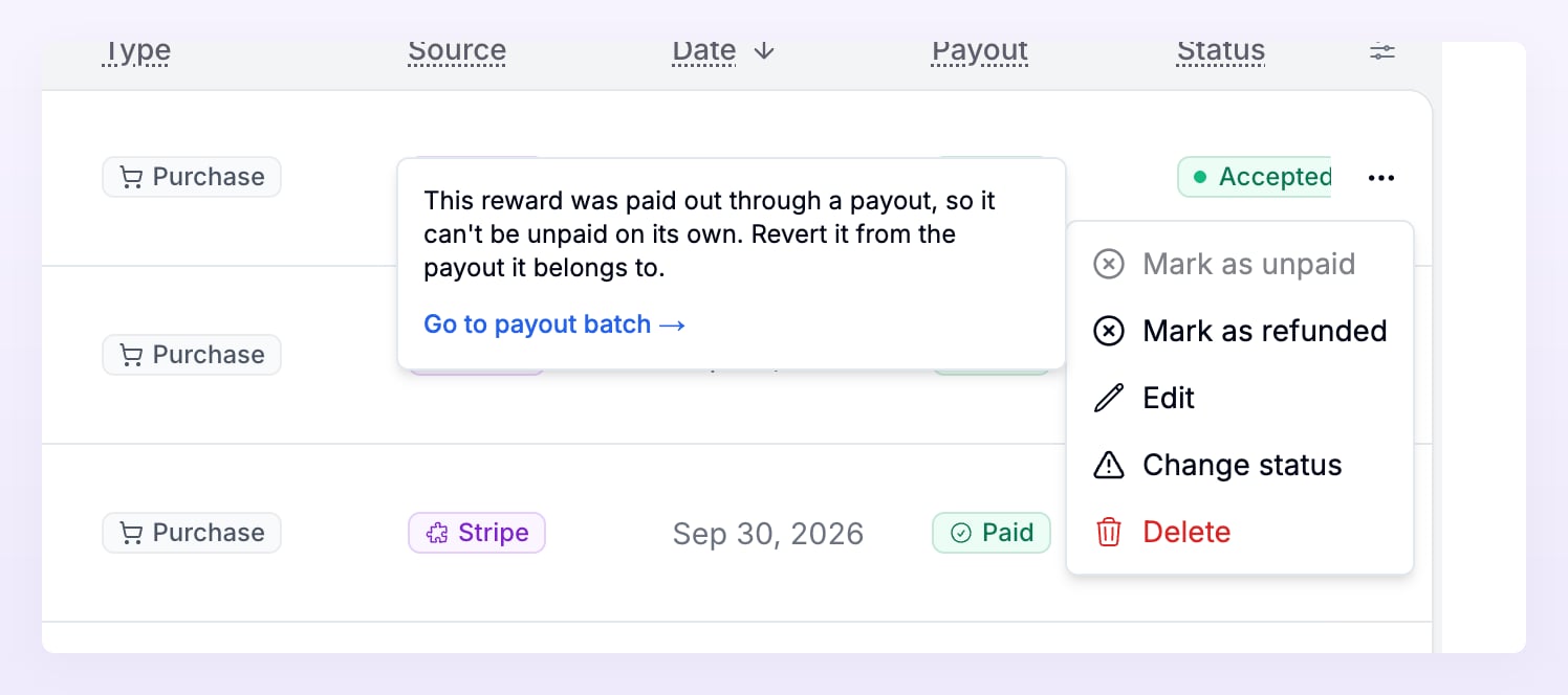Row menu of a paid reward with Mark as unpaid greyed out and the tooltip explaining it was paid through a payout, with a Go to payout batch link