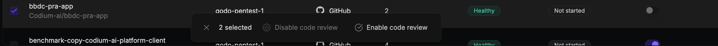 Repositories tab with multiple rows selected, showing the bulk actions bar with Disable code review and Enable code review options