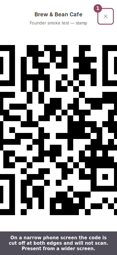 The full-screen QR code on a phone screen, cut off at the left and right edges