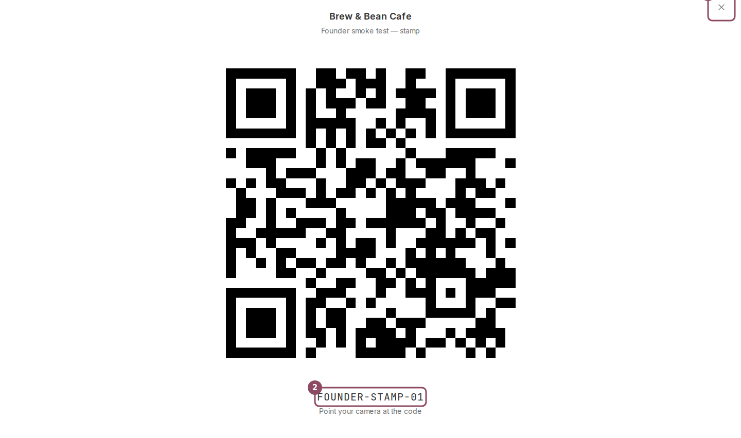 A QR code shown full-screen with the business name above and the code below