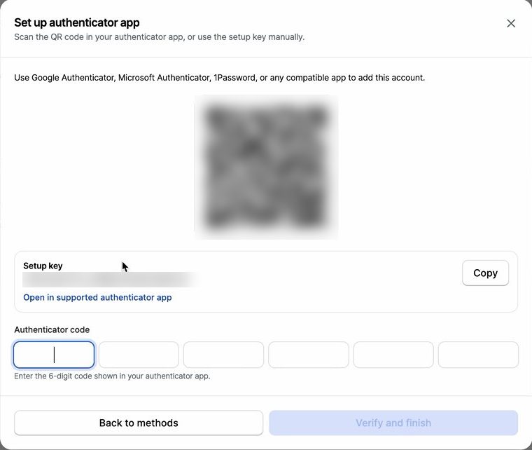 Set up authenticator app dialog showing a blurred QR code and setup key
