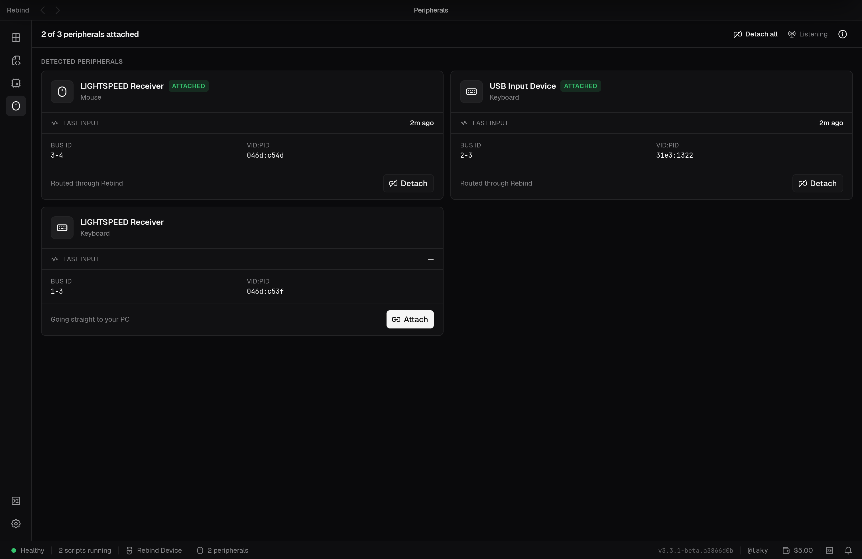 The Peripherals tab listing a detected mouse and keyboard with attach and detach controls and bus and VID:PID details