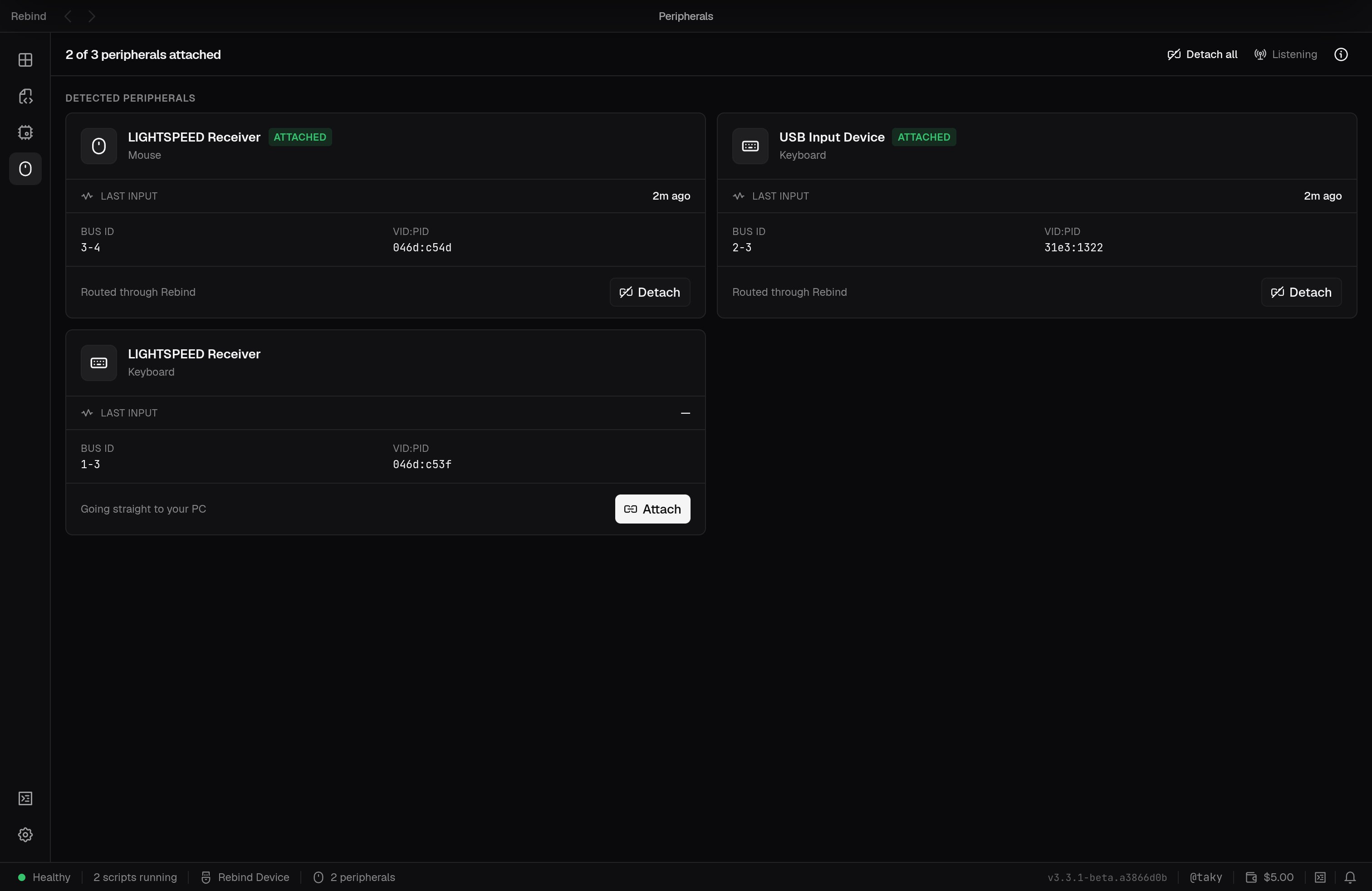 The Peripherals tab listing a detected mouse and keyboard with attach and detach controls and bus and VID:PID details
