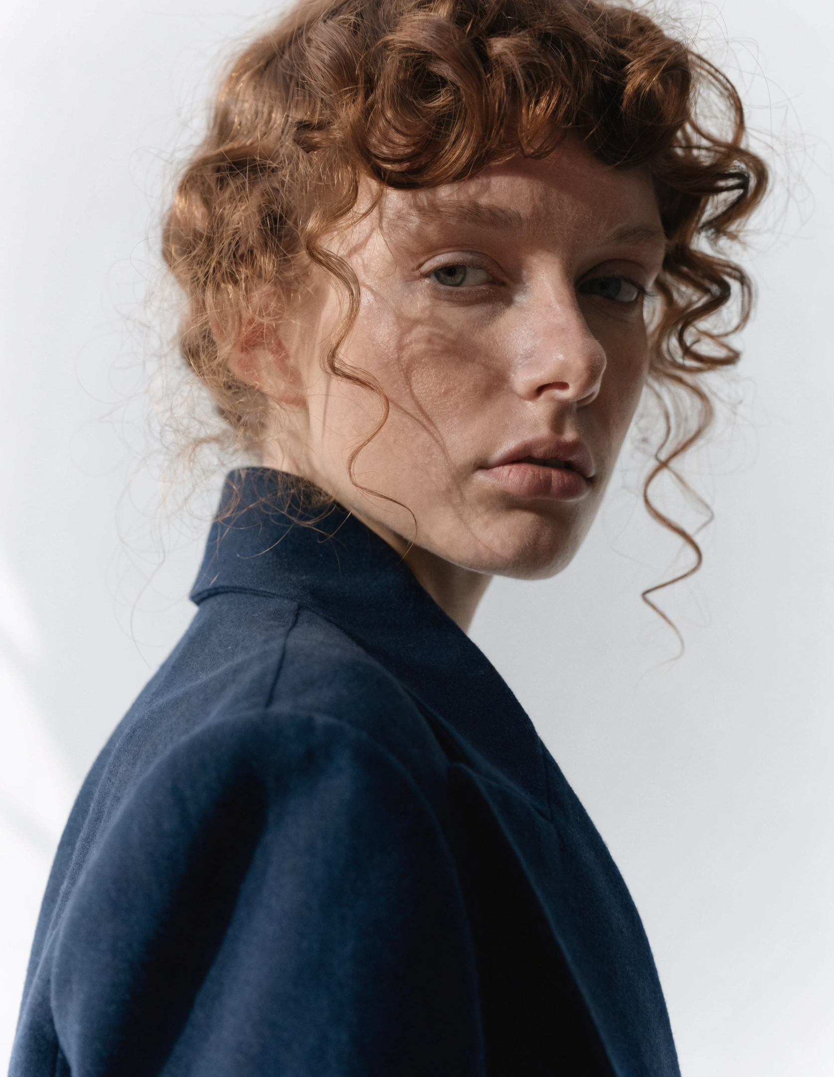 Centered close-up portrait of white woman.
