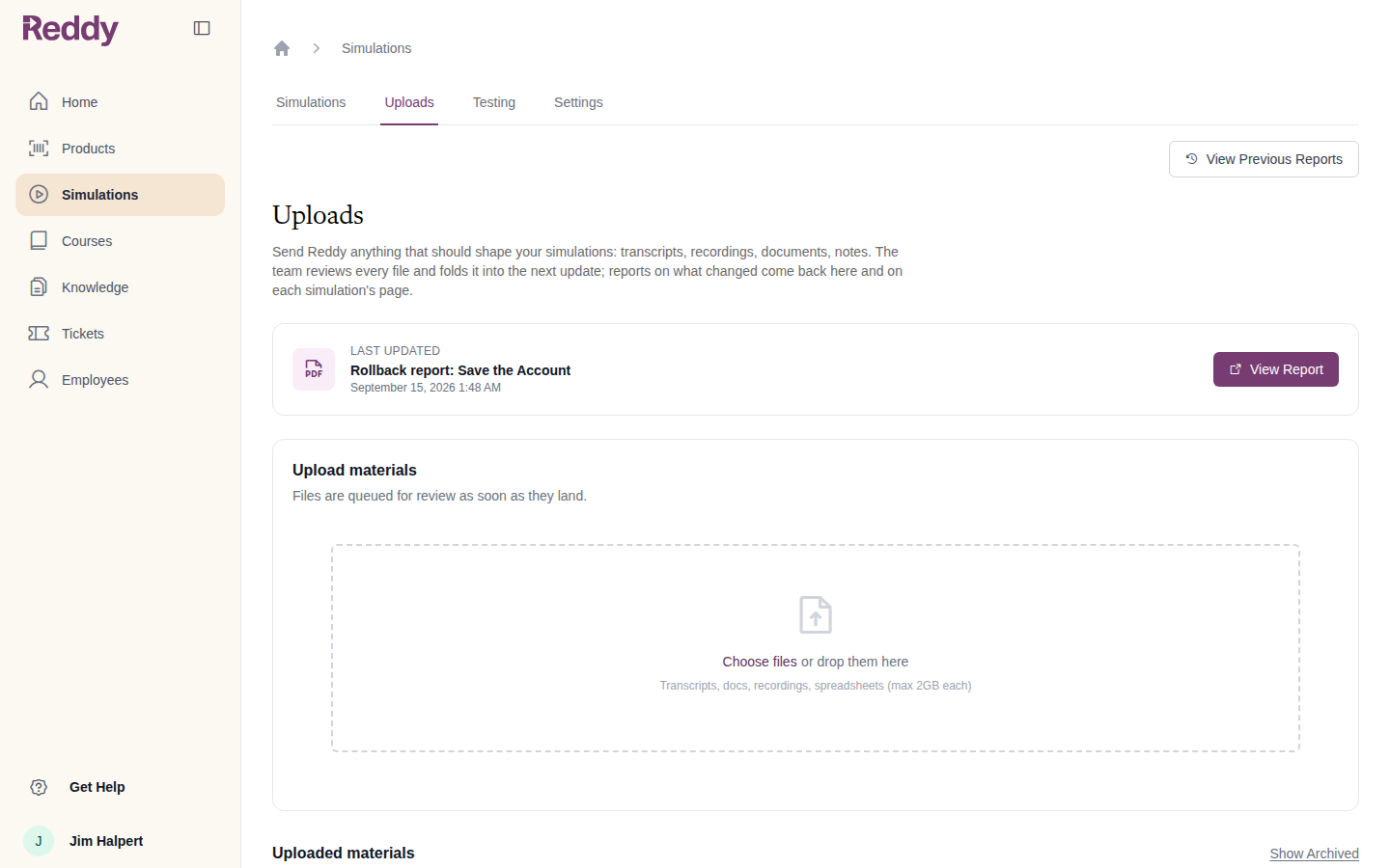 Uploads tab with the latest report, an upload dropzone accepting files up to 2GB, and the list of uploaded materials