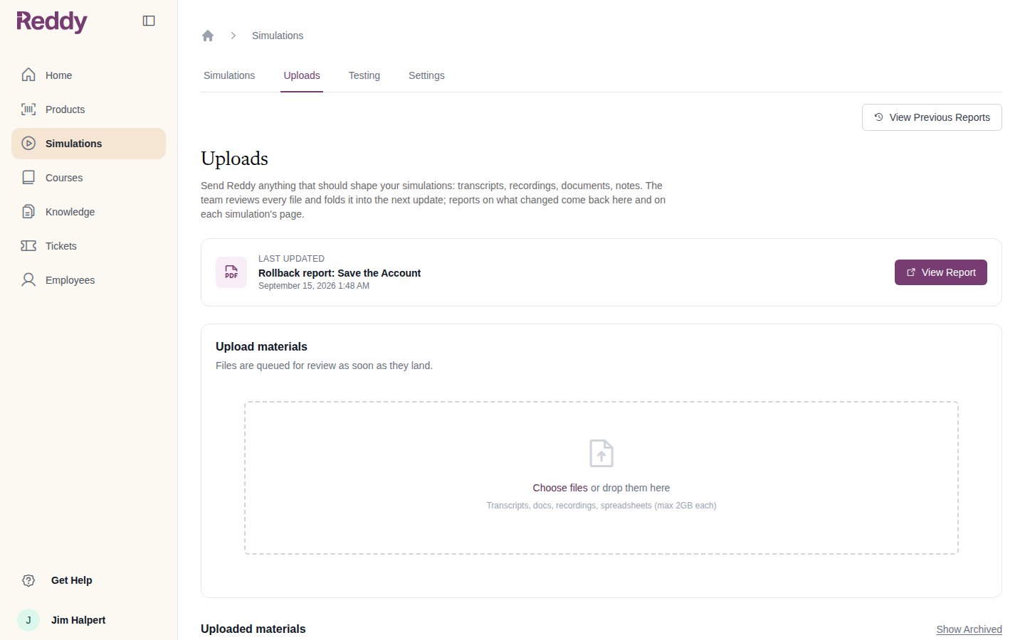 Uploads tab with the latest report, an upload dropzone accepting files up to 2GB, and the list of uploaded materials