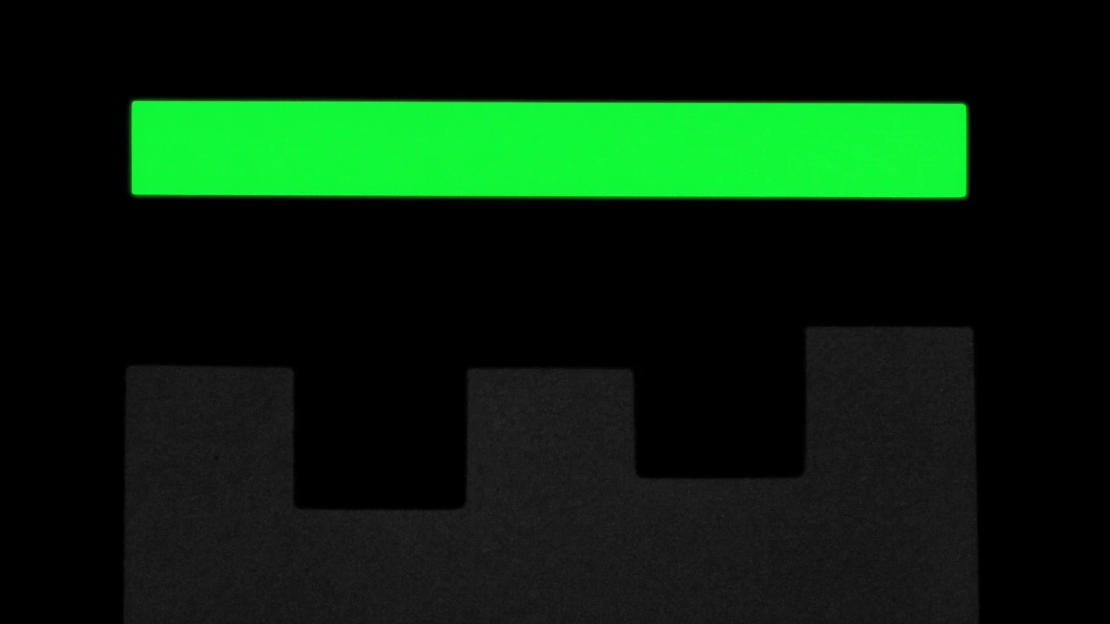 A horizontal green bar above a row of matte blocks of different heights rising towards it