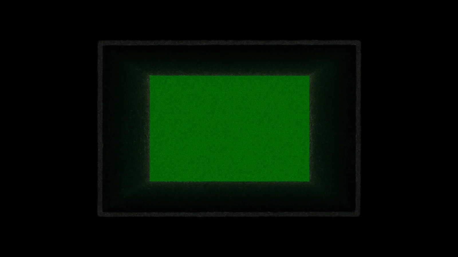 A matte, empty locker, its interior lit in green