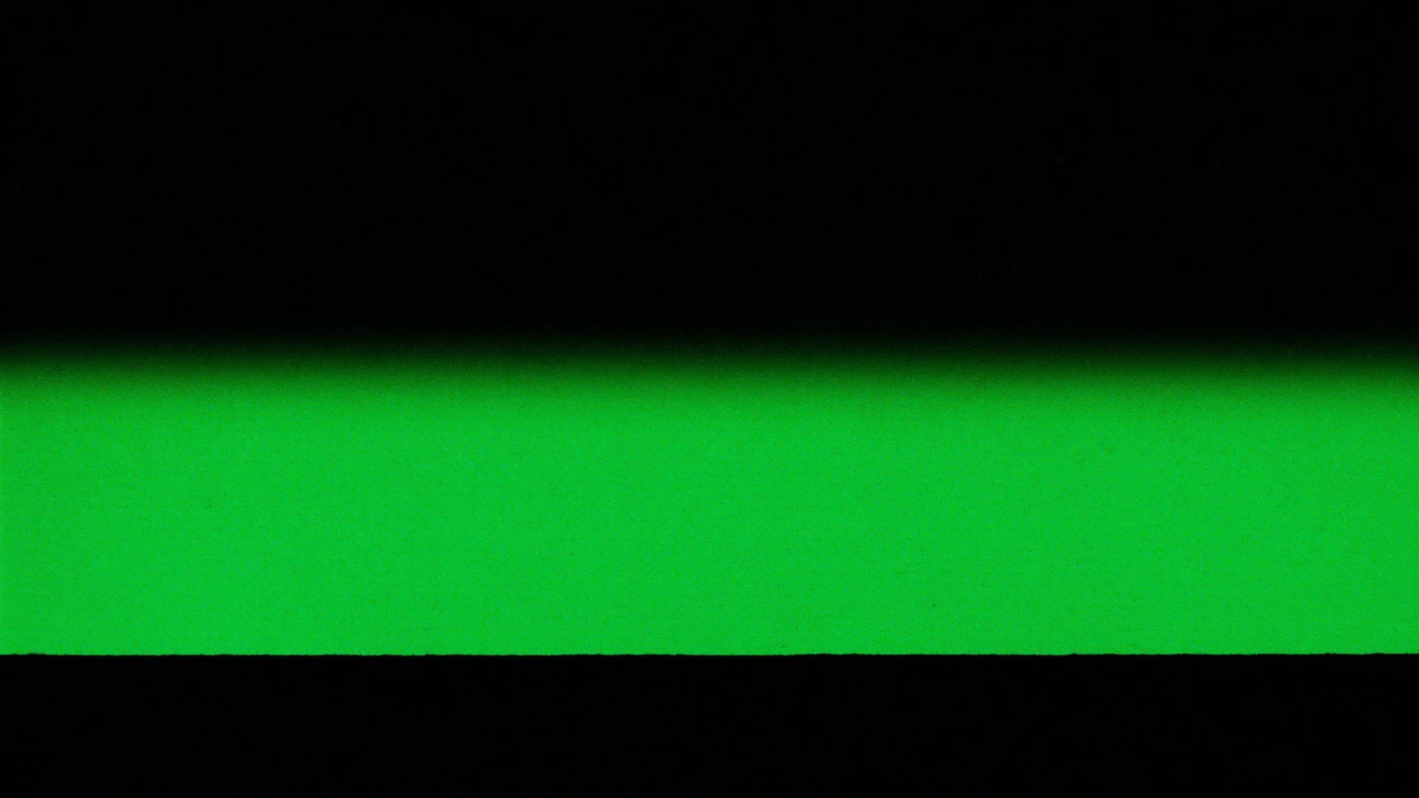 A matt plane crossed from side to side by a green line