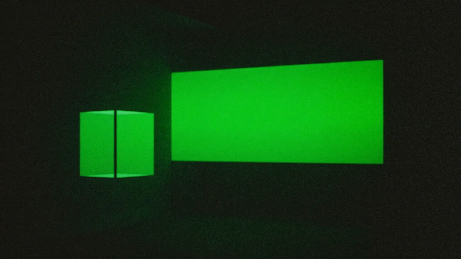 A small green rectangle of light beside a much larger one