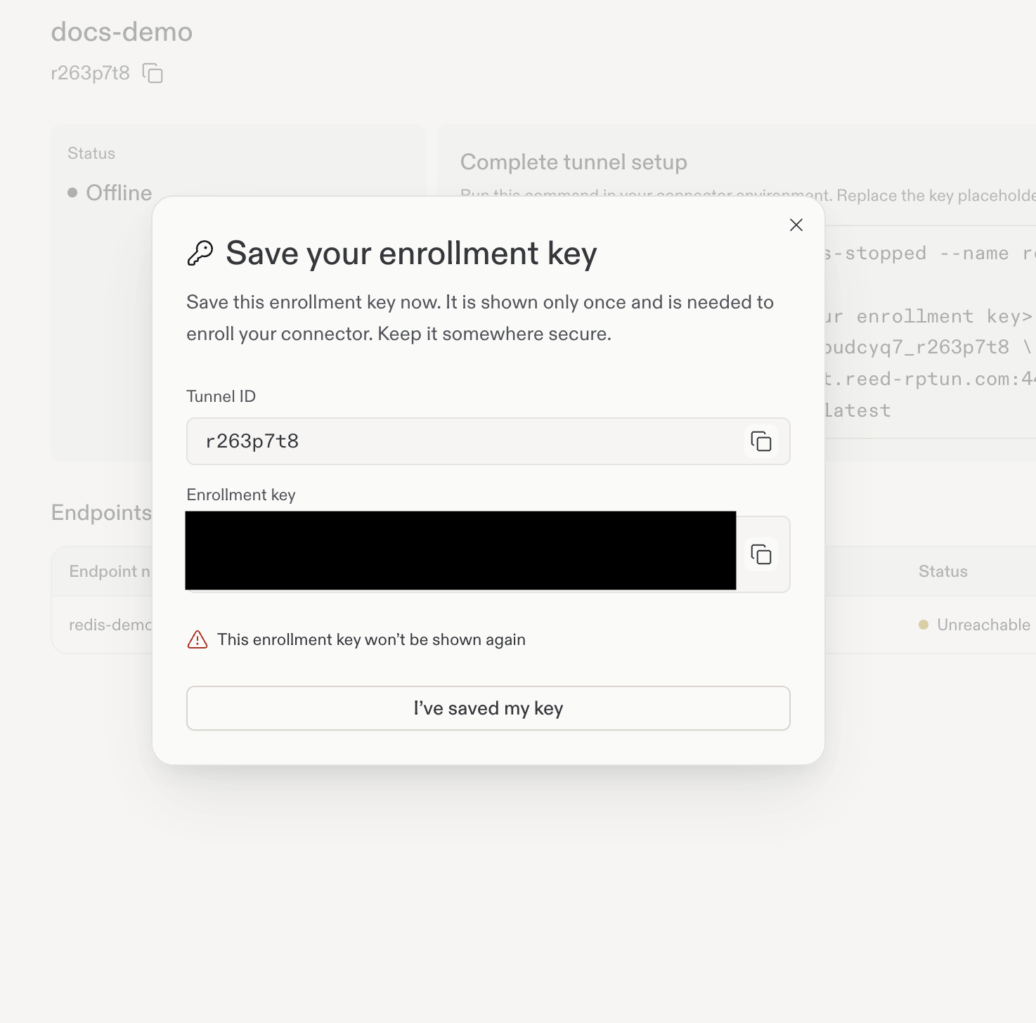 The one-time enrollment-key dialog. The key is intentionally hidden in this screenshot.