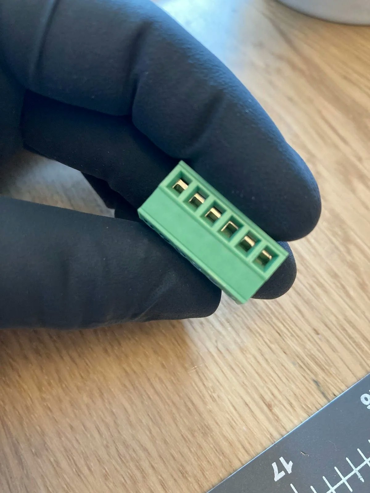 Green connector with terminals in closed position