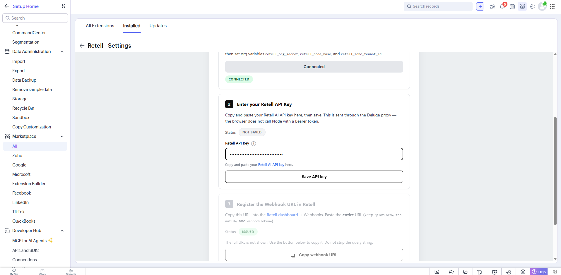 Retell Settings page in Zoho CRM with the connected status, the Retell API Key field showing Not saved, and the Register the Webhook URL in Retell section showing Issued