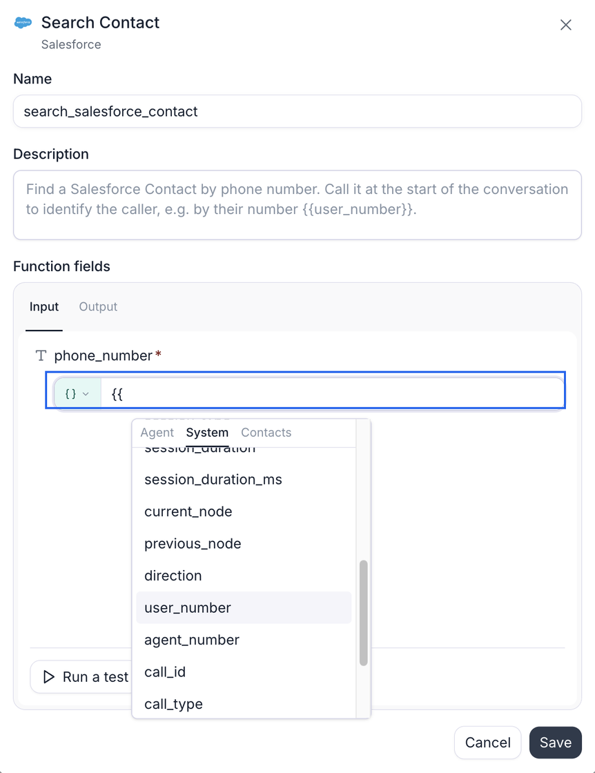 The configuration dialog for a Salesforce Search Contact function named search_salesforce_contact, whose description tells the agent to find the contact by phone number at the start of the conversation using the caller's number. In the Function fields card, on the Input tab beside an Output tab, the required phone_number field's value row is ringed in blue, showing a curly-brace value-mode pill and an input where two open braces have been typed. Below it the dynamic variable picker is open with Agent, System, and Contacts tabs, System selected, listing session_duration_ms, current_node, previous_node, direction, user_number highlighted, agent_number, call_id, and call_type. A Run a test button sits at the bottom of the card, with Cancel and Save below.