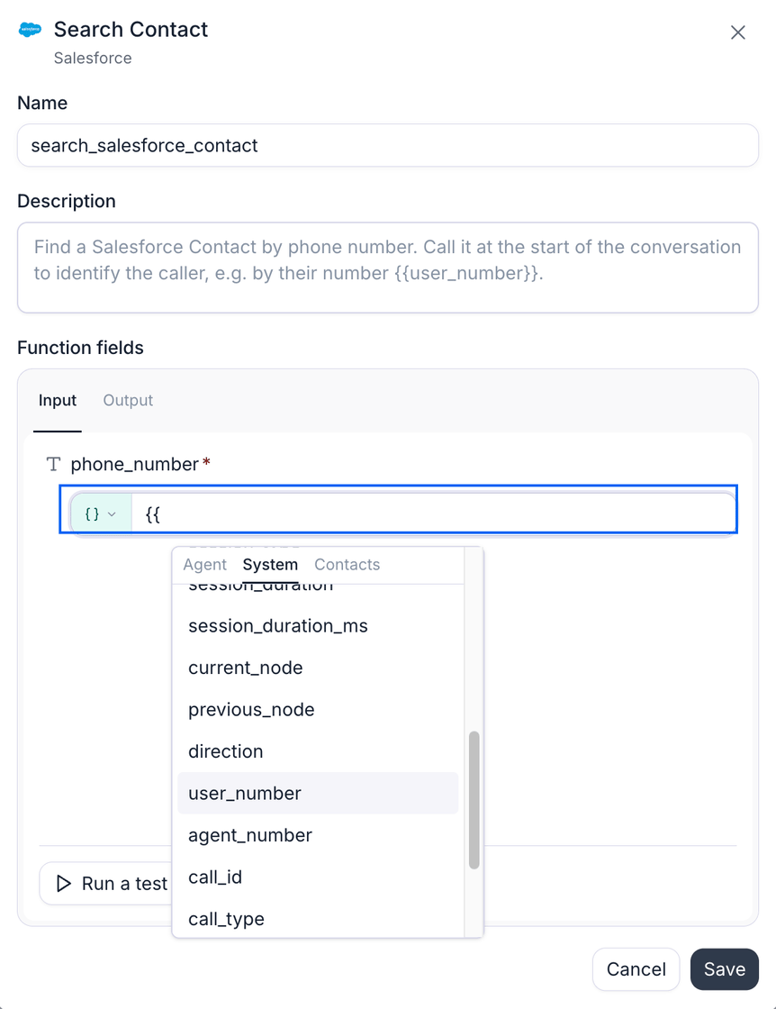 The configuration dialog for a Salesforce Search Contact function named search_salesforce_contact, whose description tells the agent to find the contact by phone number at the start of the conversation using the caller's number. In the Function fields card, on the Input tab beside an Output tab, the required phone_number field's value row is ringed in blue, showing a curly-brace value-mode pill and an input where two open braces have been typed. Below it the dynamic variable picker is open with Agent, System, and Contacts tabs, System selected, listing session_duration_ms, current_node, previous_node, direction, user_number highlighted, agent_number, call_id, and call_type. A Run a test button sits at the bottom of the card, with Cancel and Save below.