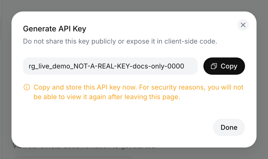 Generate API Key dialog showing a fake demo key in a read-only field, a Copied button, the warning to copy and store the key now, and a Done button