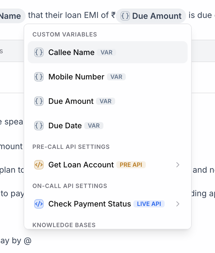 Mention menu opened by typing @, grouped into Custom Variables (Callee Name, Mobile Number, Due Amount, Due Date), Pre-call API settings (Get Loan Account) and On-call API settings (Check Payment Status), with Knowledge Bases below