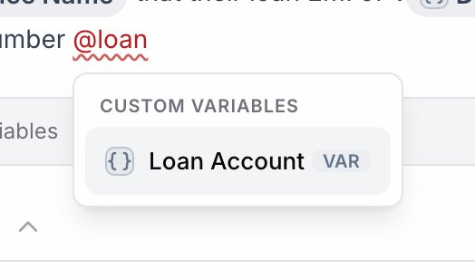 Prompt text ending in @loan with the mention menu showing Loan Account under Custom Variables