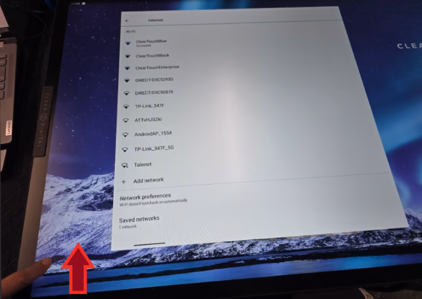 Arrow showing the upward swipe from the bottom-left corner of Settings