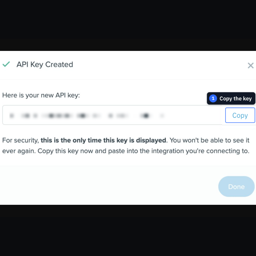 A mobile close-up of the gently blurred Follow Up Boss API key with Copy highlighted