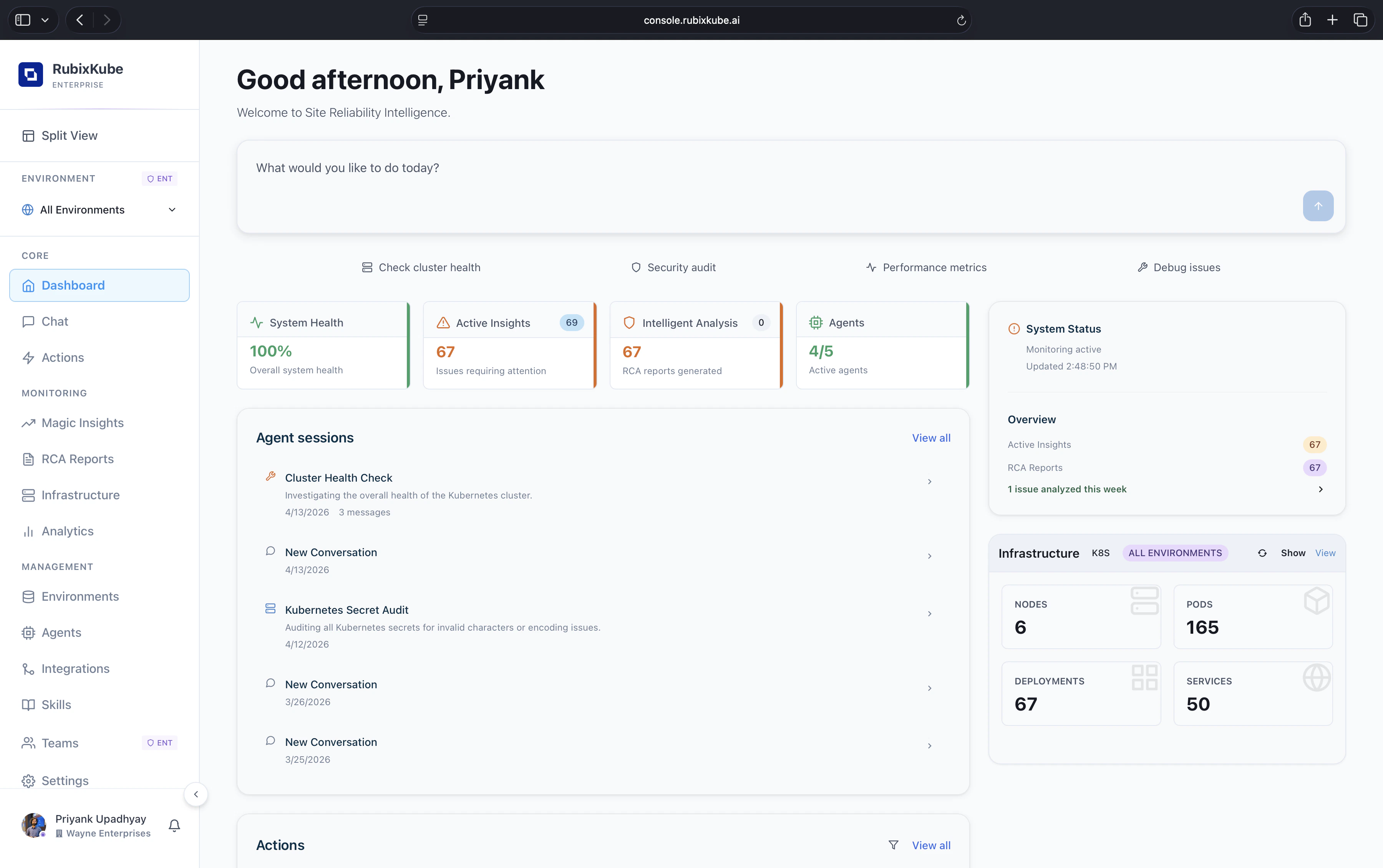 RubixKube Dashboard showing greeting, chat bar, quick actions, health tiles, agent sessions, system status, infrastructure, actions, insights and RCA reports