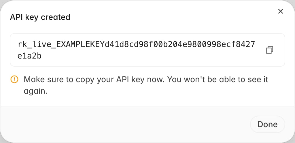 API key created dialog showing the full API key with a copy button and a warning that the key cannot be viewed again