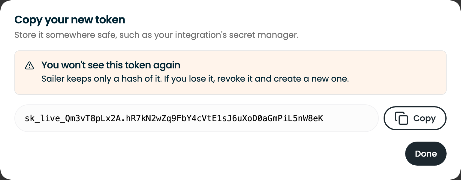 The one-time reveal of a new token, with a Copy button and a warning that it won't be shown again