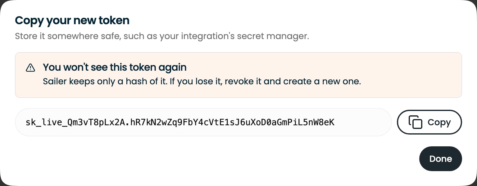The one-time reveal of a new token, with a Copy button and a warning that it won't be shown again