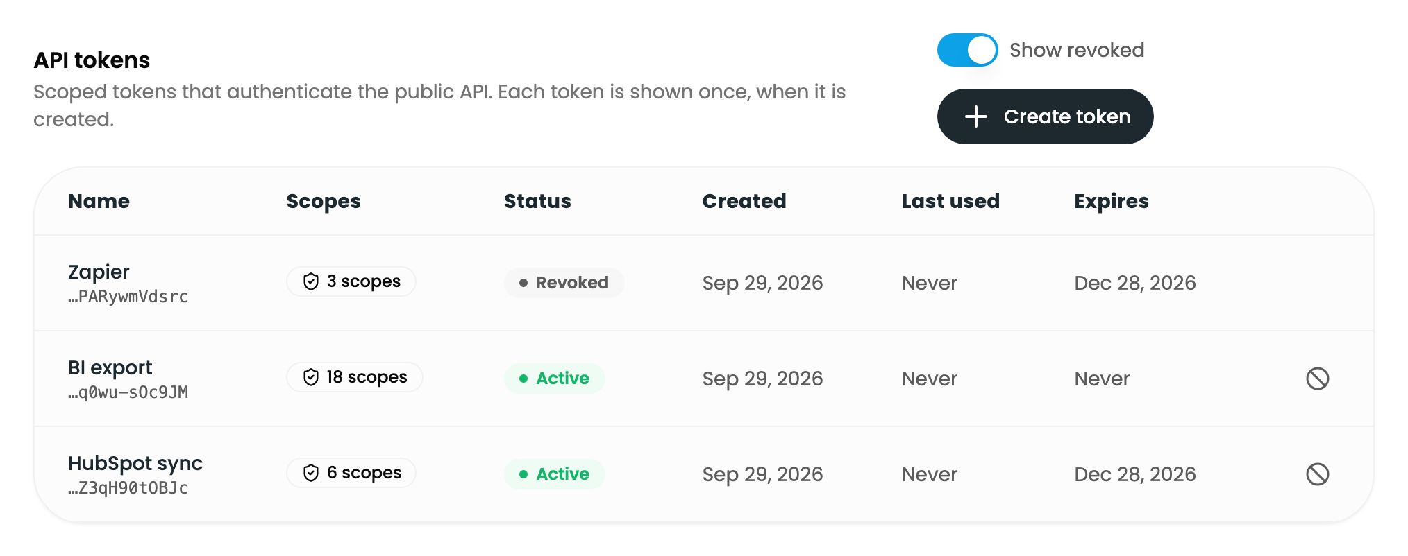 The token list with Show revoked on: one revoked token and two active ones