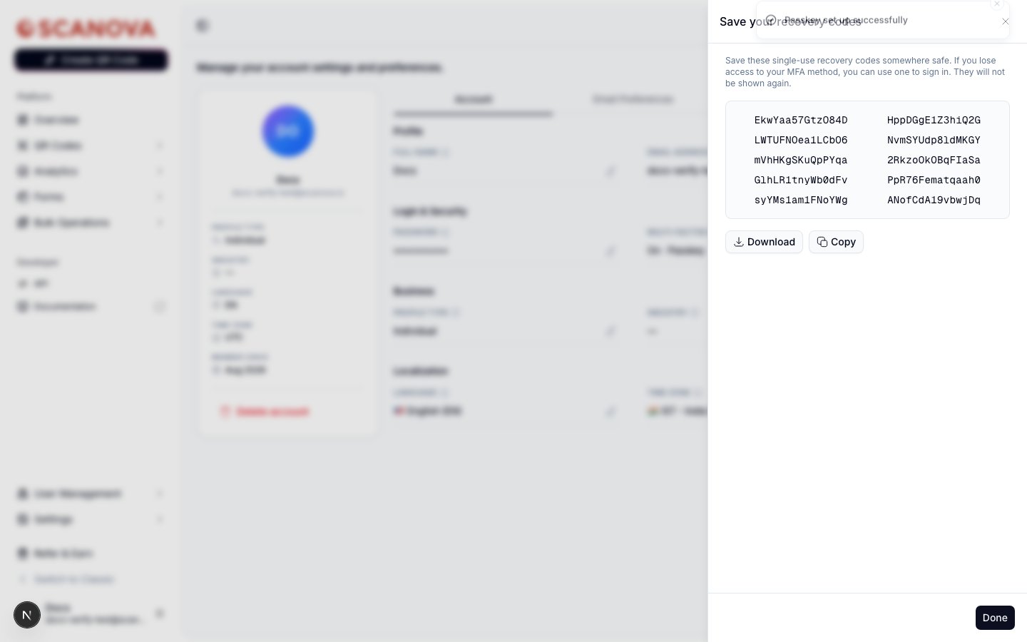 Save your recovery codes step showing a grid of ten single-use backup codes, with Download and Copy buttons and a Done button