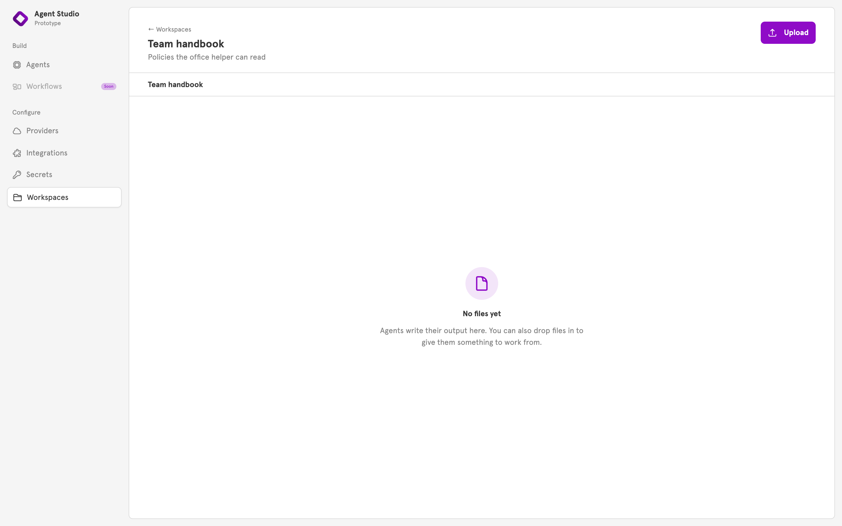 An empty workspace page with the Upload button