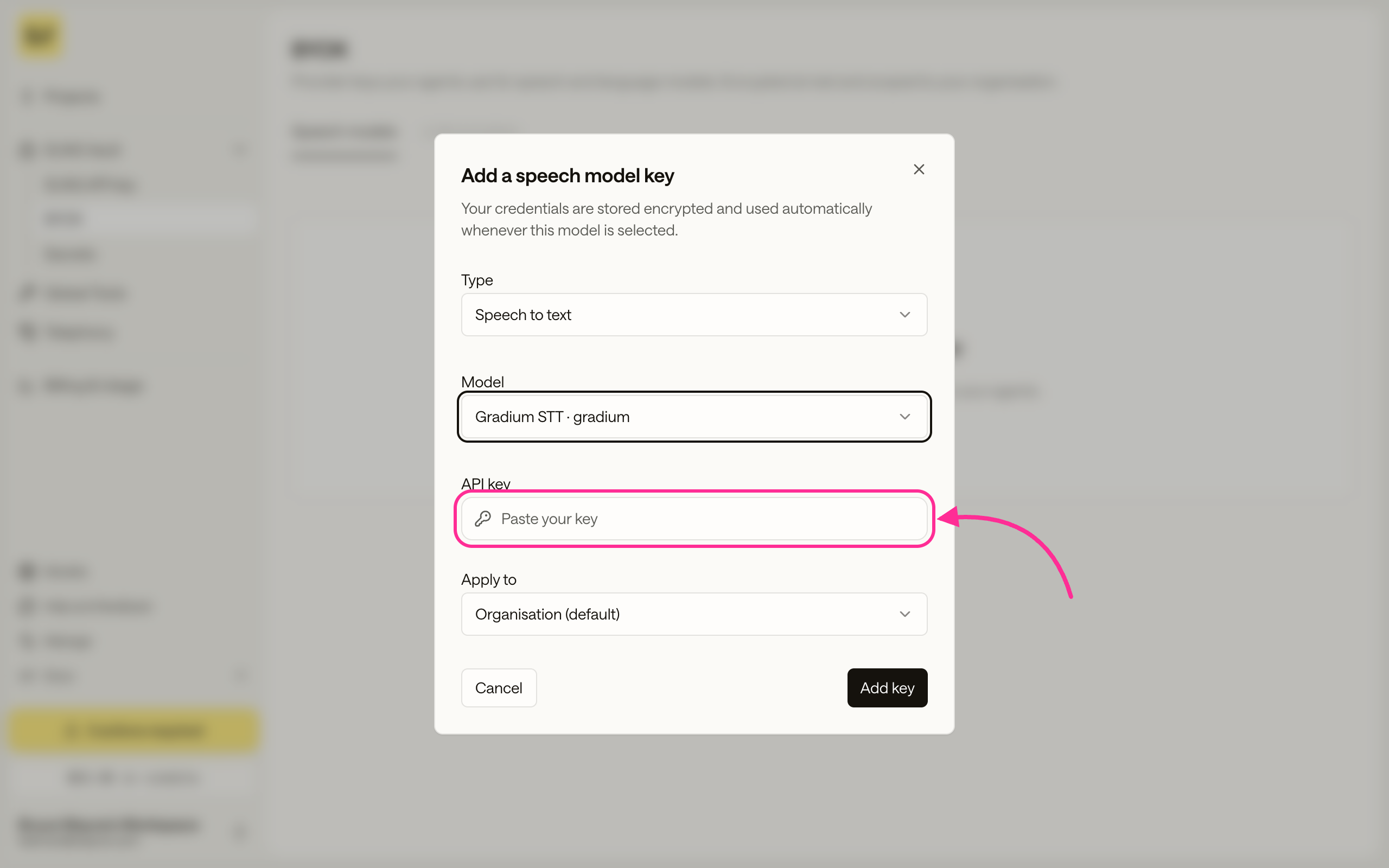 The Add a speech model key dialog with a model selected and the API key field ready for a key