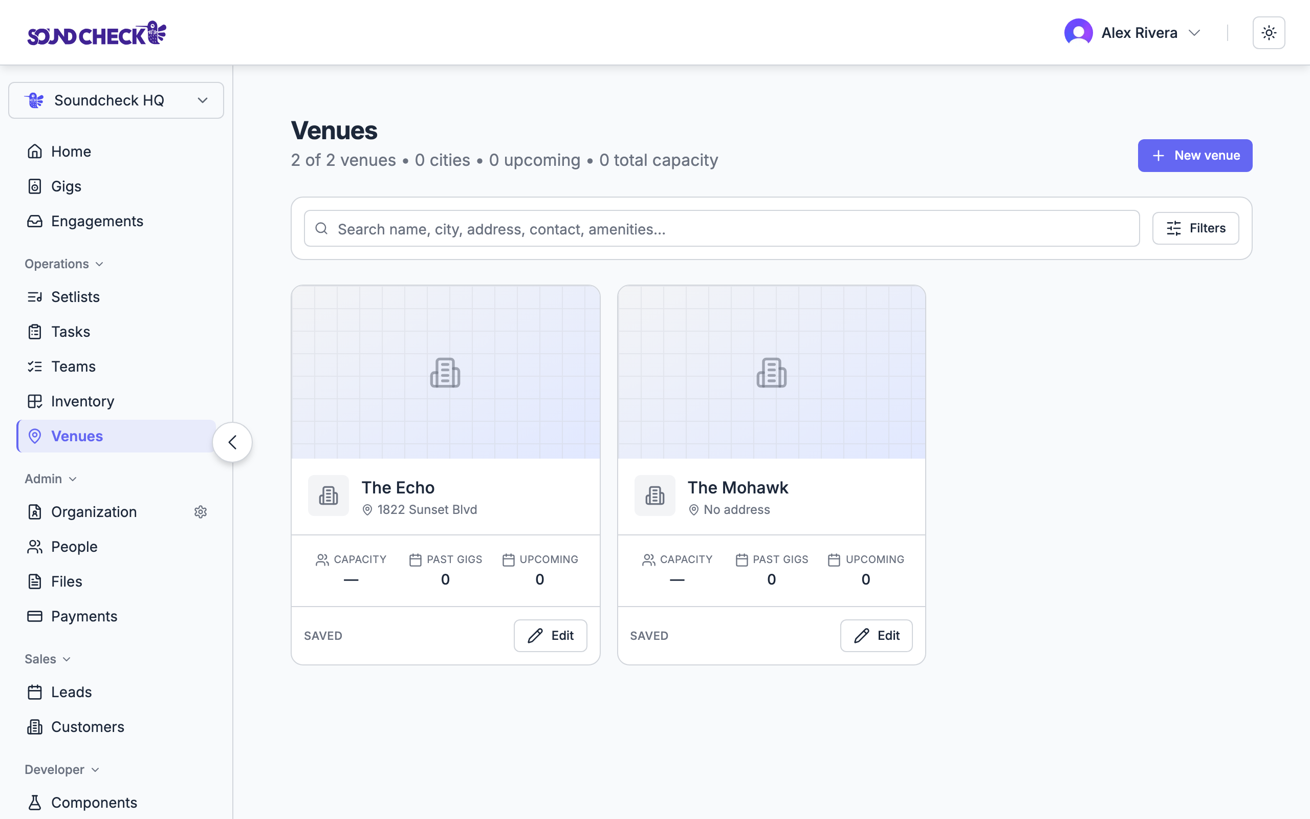 Venue directory with saved venue cards showing capacity and gig counts