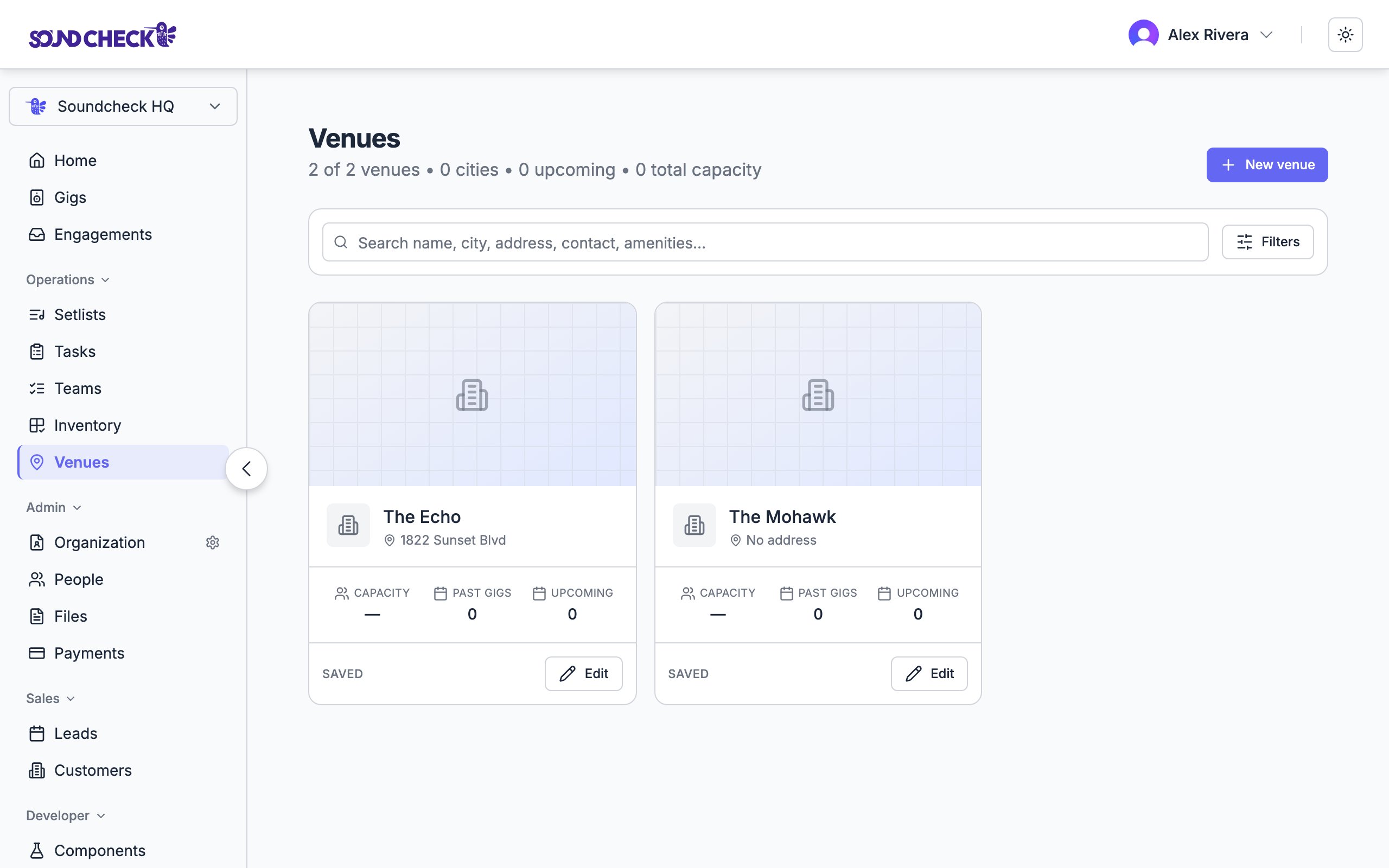 Venue directory with saved venue cards showing capacity and gig counts