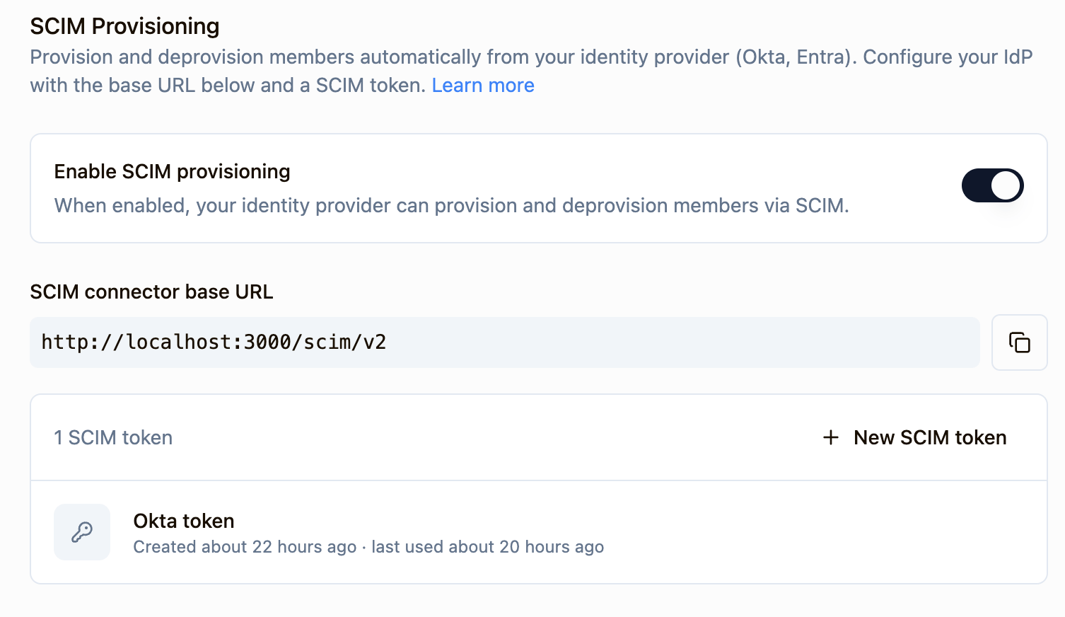 SCIM provisioning settings in Sourcebot showing the enable toggle, connector base URL, and SCIM token list