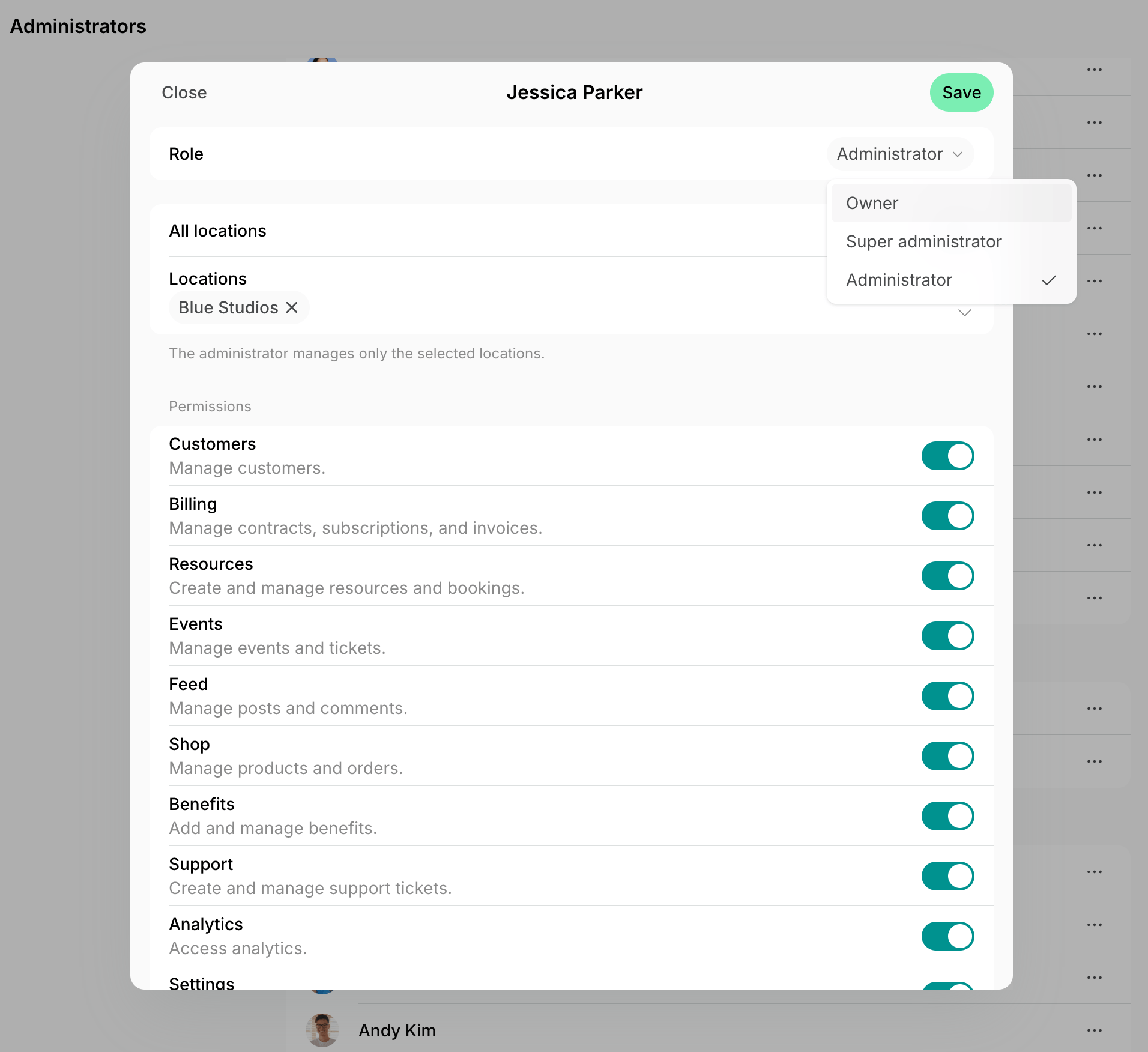 Administrator edit form with the Role menu open on Owner, the locations they manage, and permission switches on Spacebring's coworking space management platform