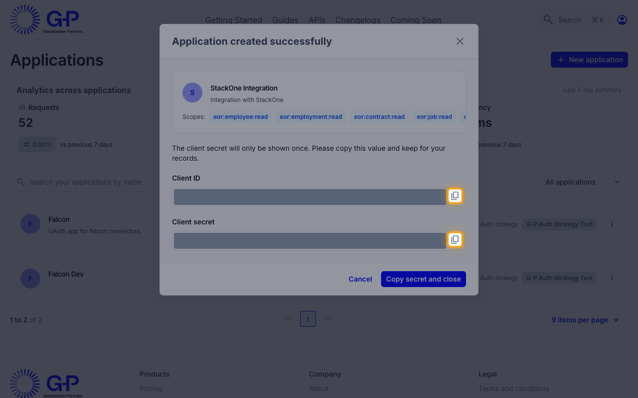 The Application created successfully dialog with the copy icons for Client ID and Client secret highlighted and the values masked