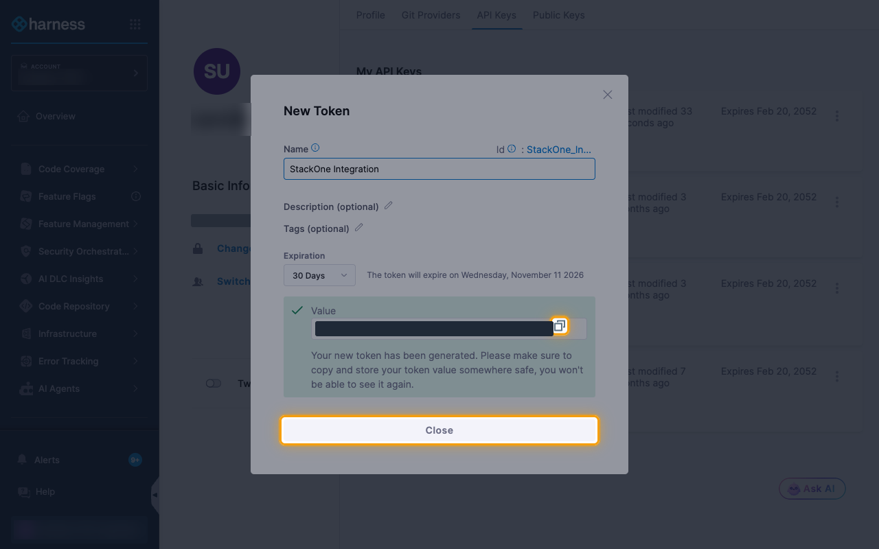 The generated token with its value hidden, and the copy icon and Close button highlighted