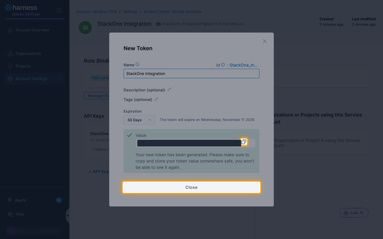 The generated token with its value hidden, and the copy icon and Close button highlighted