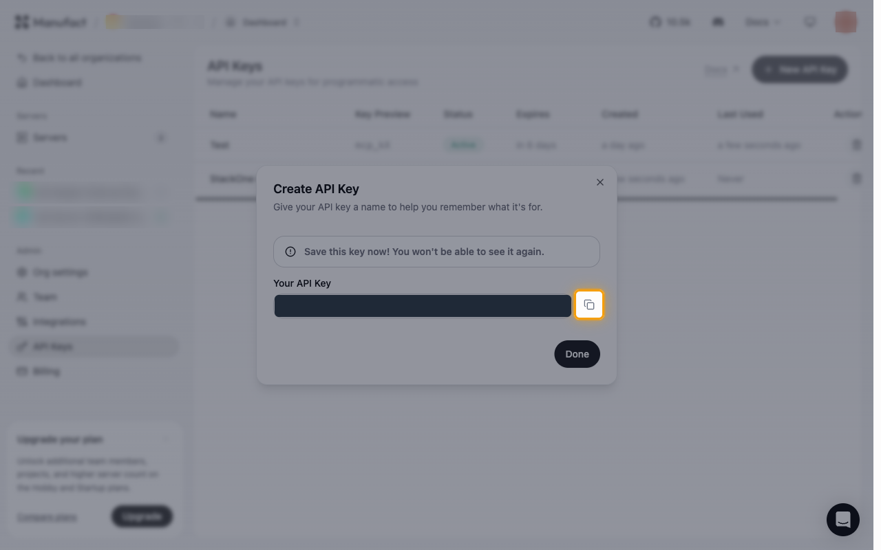 The Create API Key dialog showing the generated key redacted, with the Copy button highlighted