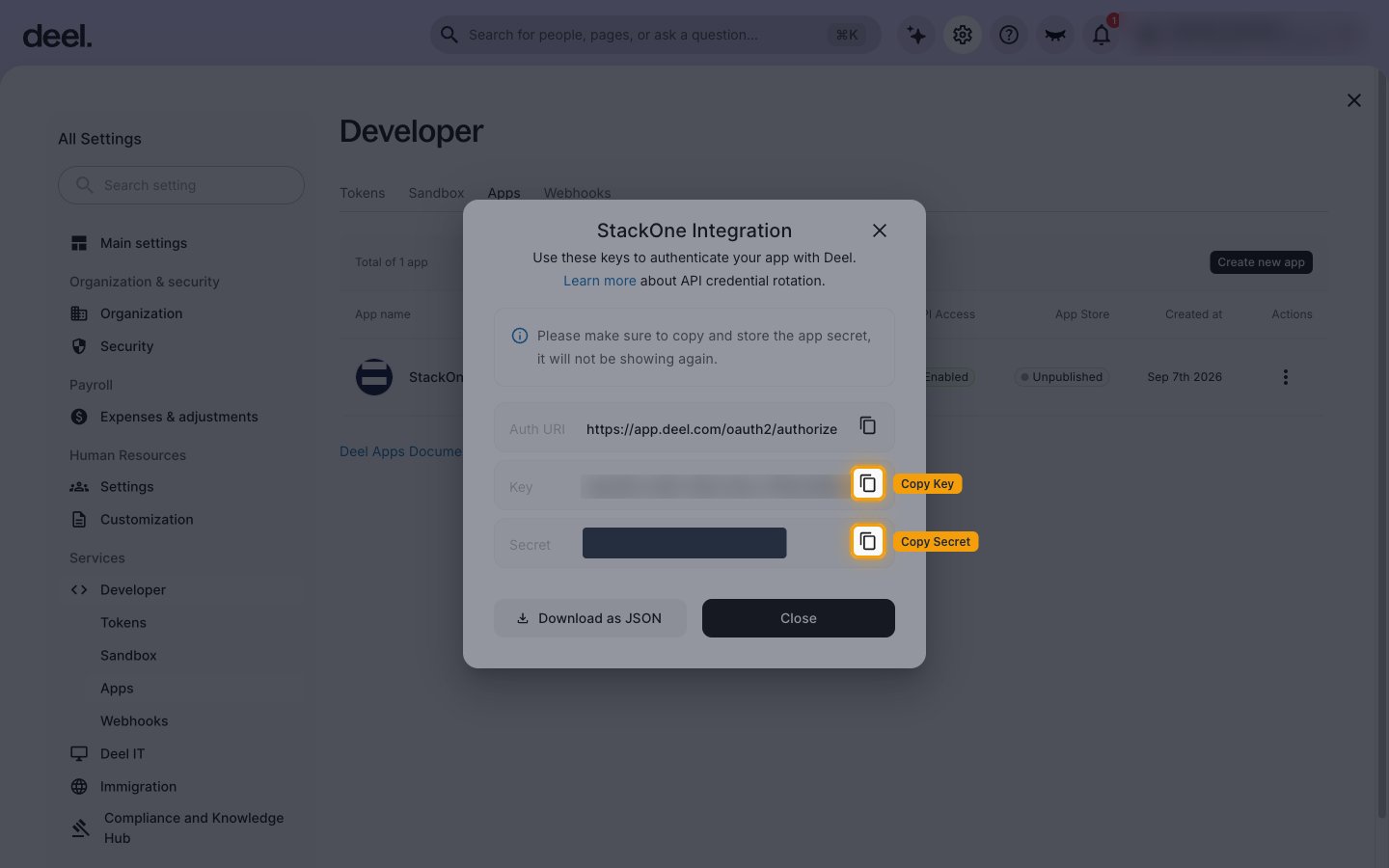 The app credentials dialog with the Secret value masked and the Copy buttons for Key and Secret highlighted