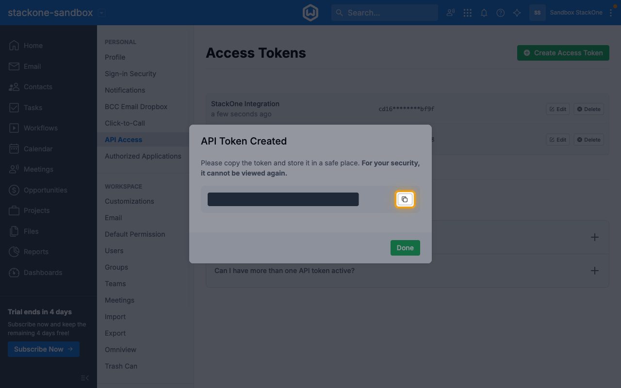 The API Token Created dialog with the token hidden and the copy button highlighted