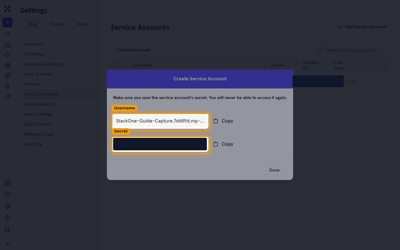 The created service account showing the Username and masked Secret with Copy buttons
